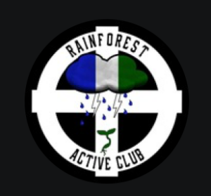 Rainforest Active Club logo: a white celtic cross on a black ground, with the groups name as text in the circle. In the middle there is a cloud colored like the Northwest Territorial Imperative flag, emitting rain and two lightning bolts arranged like the SS logo. 